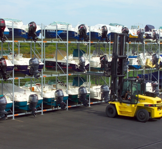 Dry dock with outdoor boat storage racks and forklift
                