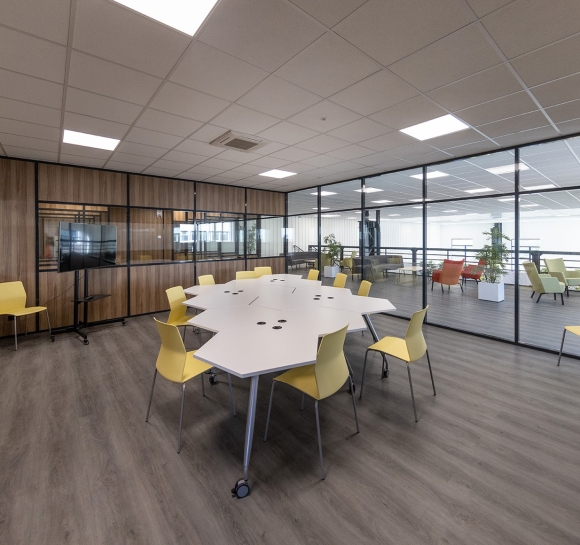 Meeting room with designer tables and chairs, installed on an office platform